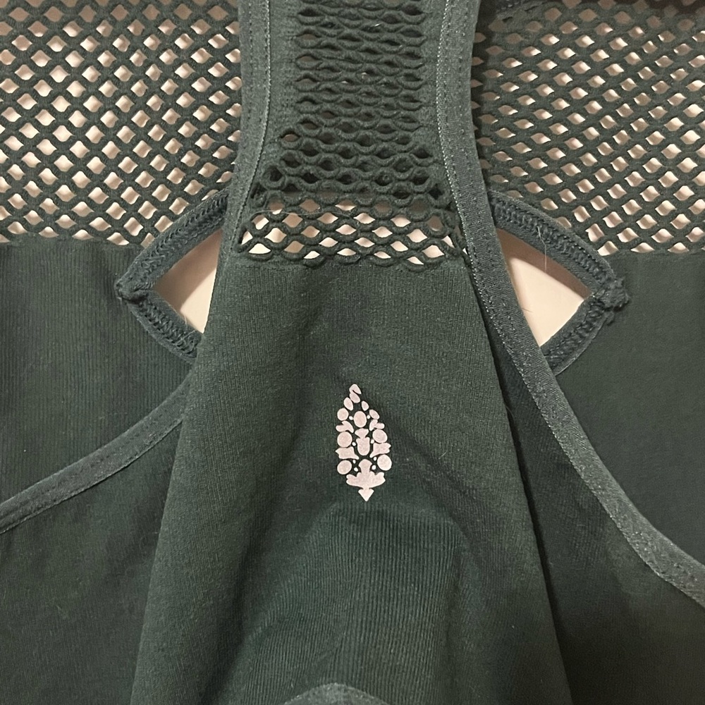 New with Logo. Free people M/L onesie. No tag.